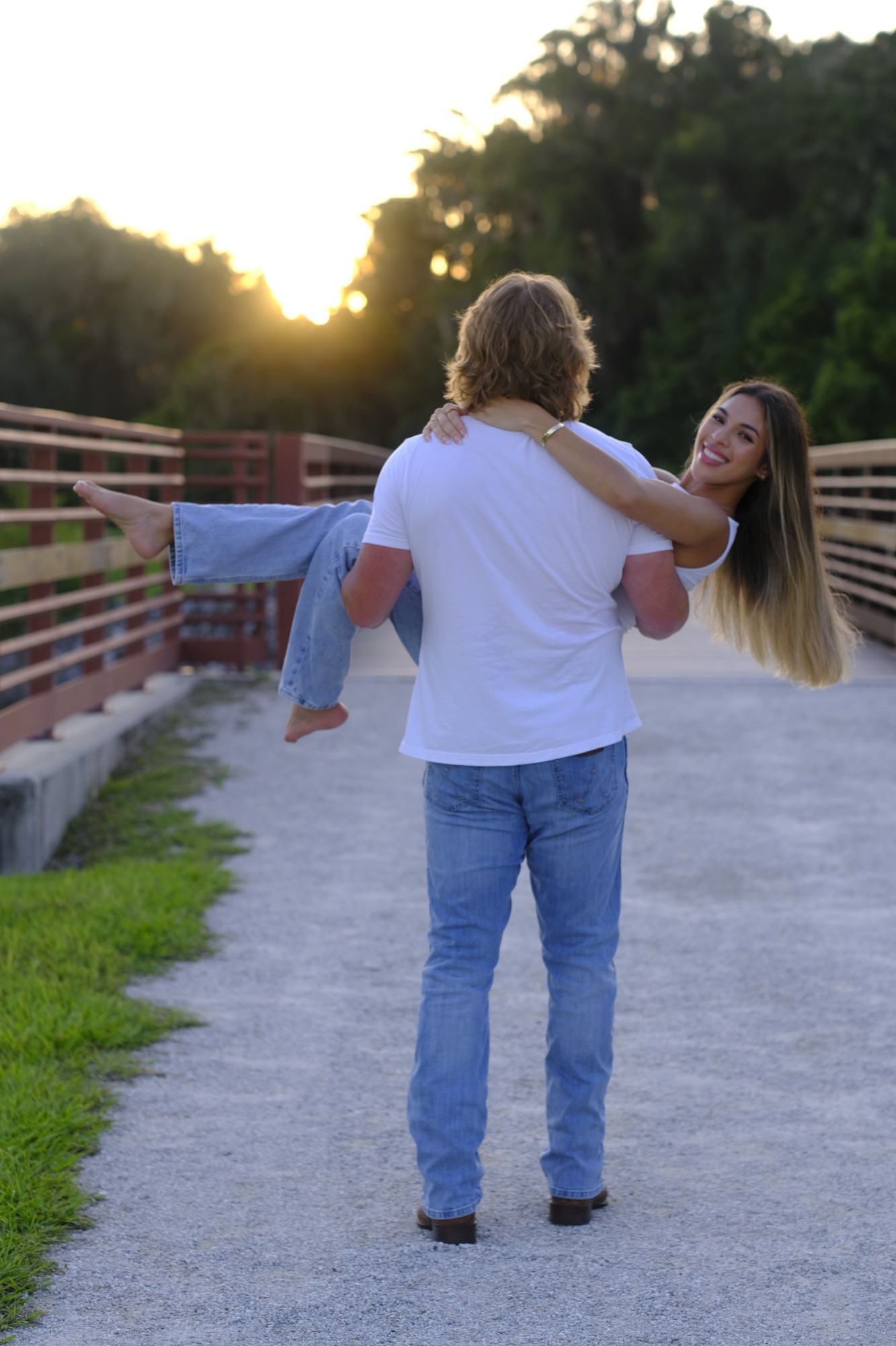Couple on bridge at sunset